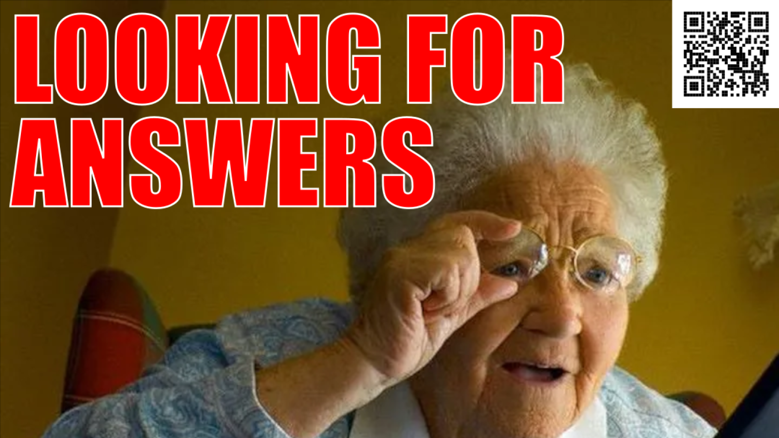 Old woman peering closely through glasses at a laptop screen. - caption: LOOKING FOR ANSWERS