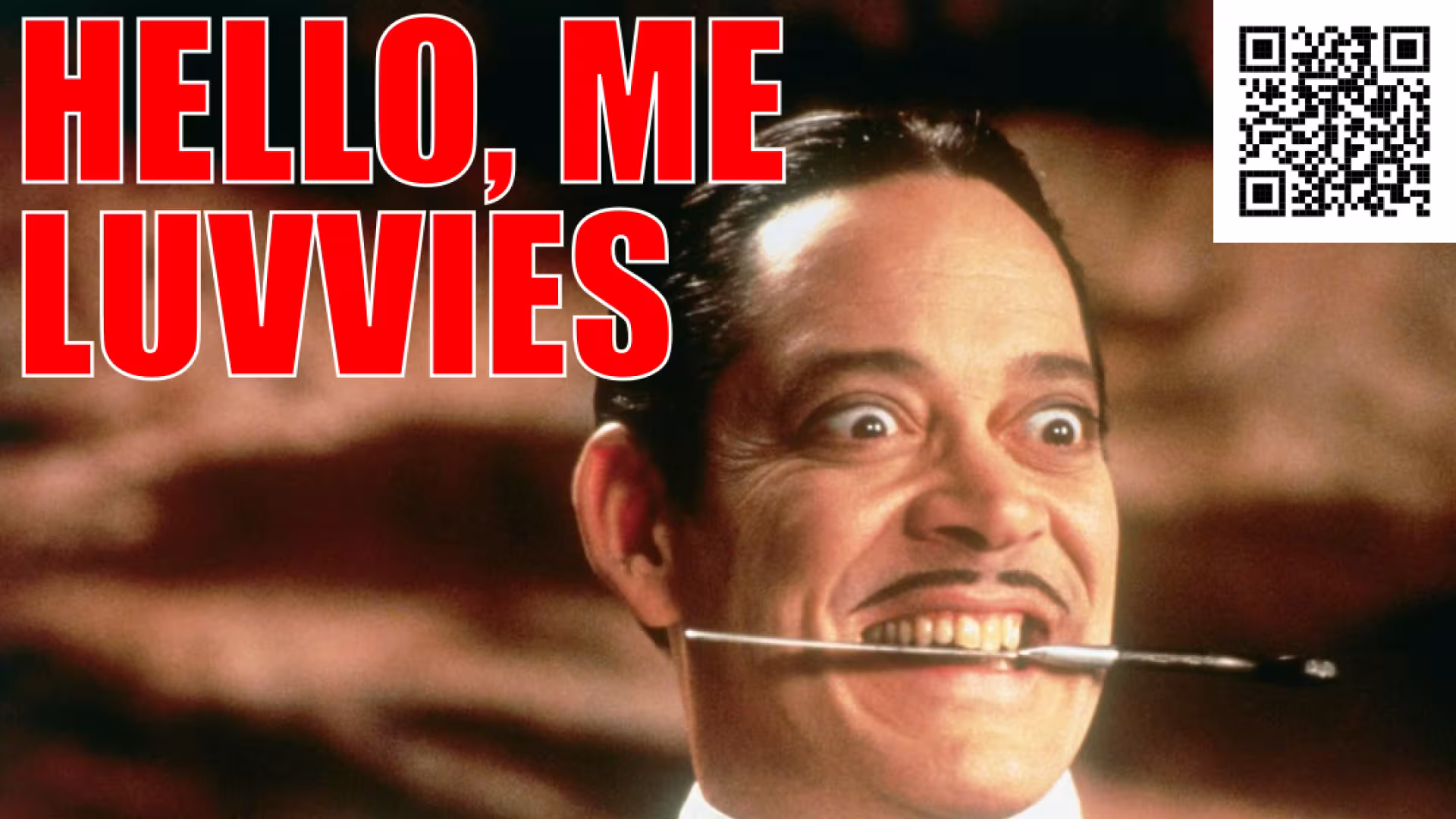 Raul Julia as Gomez Addams with a knife caught between his teeth - caption: Hello, me luvvies!